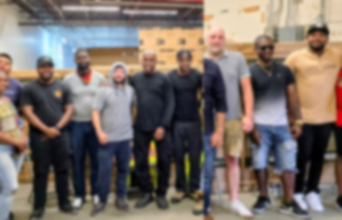 CARE delivery and installation team at the warehouse